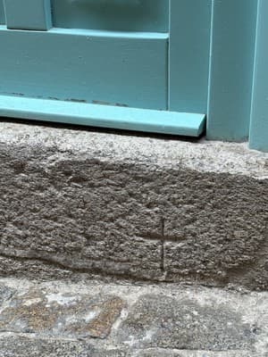 Crosses carved in stone at homes of forcibly converted Jews