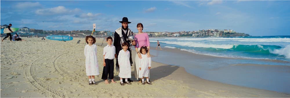 Rabbi Mendel Kastel and family, from Welcome to Sydney (2002), courtesy JMA