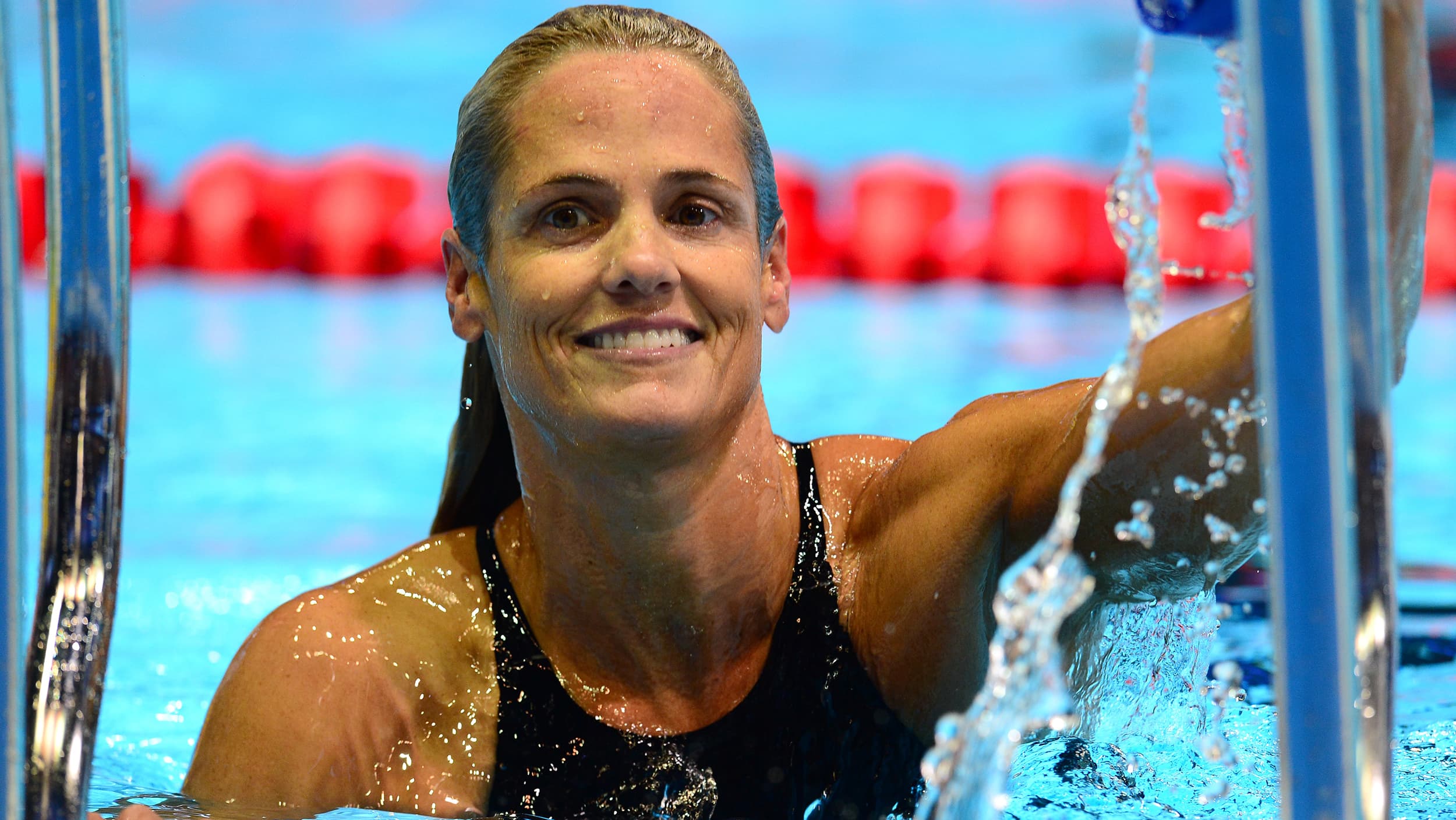 Image: Dara Torres, 45, leaves the pool followi