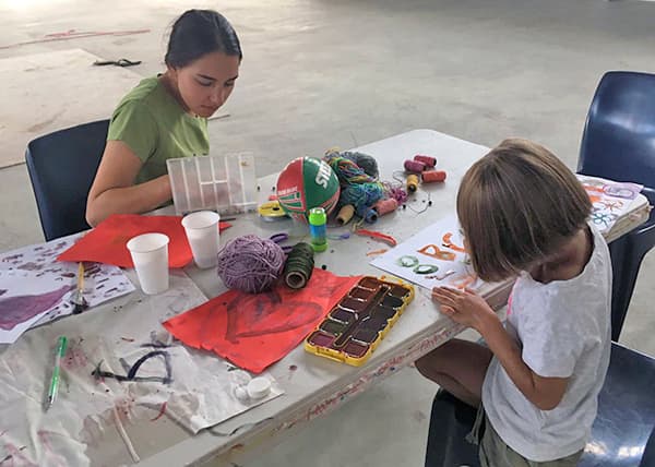 Volunteer Ellie Casper assisting with a school holiday program in Boggabilla