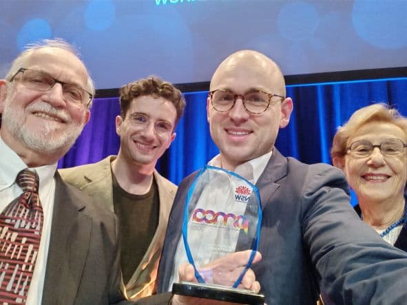 Publisher Uri Windt, filmmaker Benjamin Strum, Executive Director Dashiel Lawrence and General Manager Ilona Lee with the award.