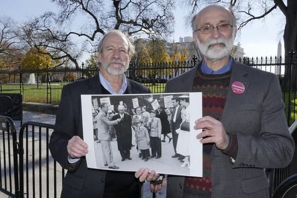 Michael and Robert Meeropol, the Rosenbergs' sons, outside the White House in 2016 at a rally aimed at clearing their mother's name. (Alan Heath/Rosenberg Fund for Children)
