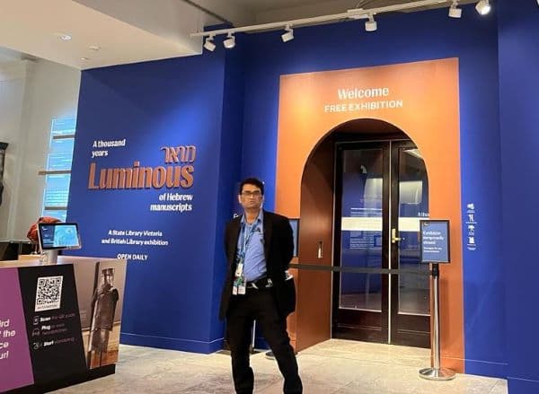 A security guard at the entrance to the 'Luminous' exhibition (Sidra Kranz Moshinsky)