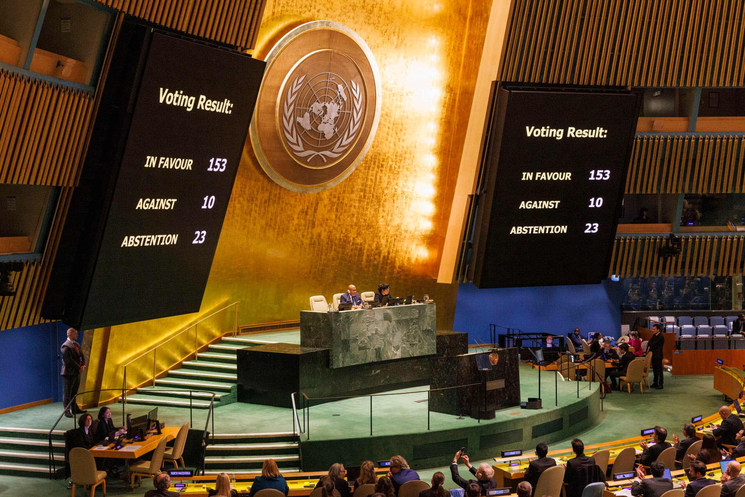 Scoreboard showing 'Voting result In favour 153. Against 10, Abstention 23"