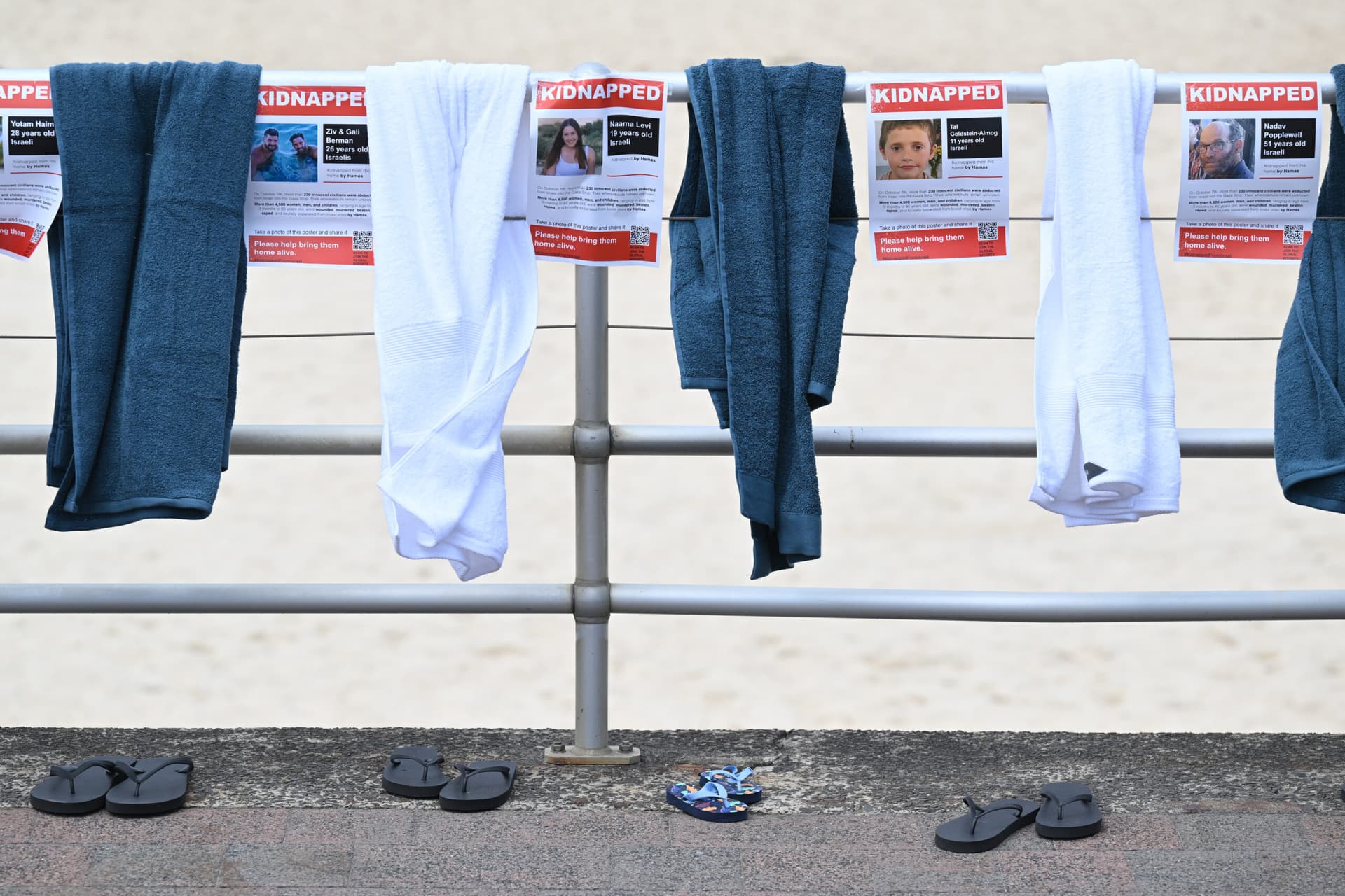 An installation of beach towels and thongs at Bondi Beach (AAP /Dean Lewins).