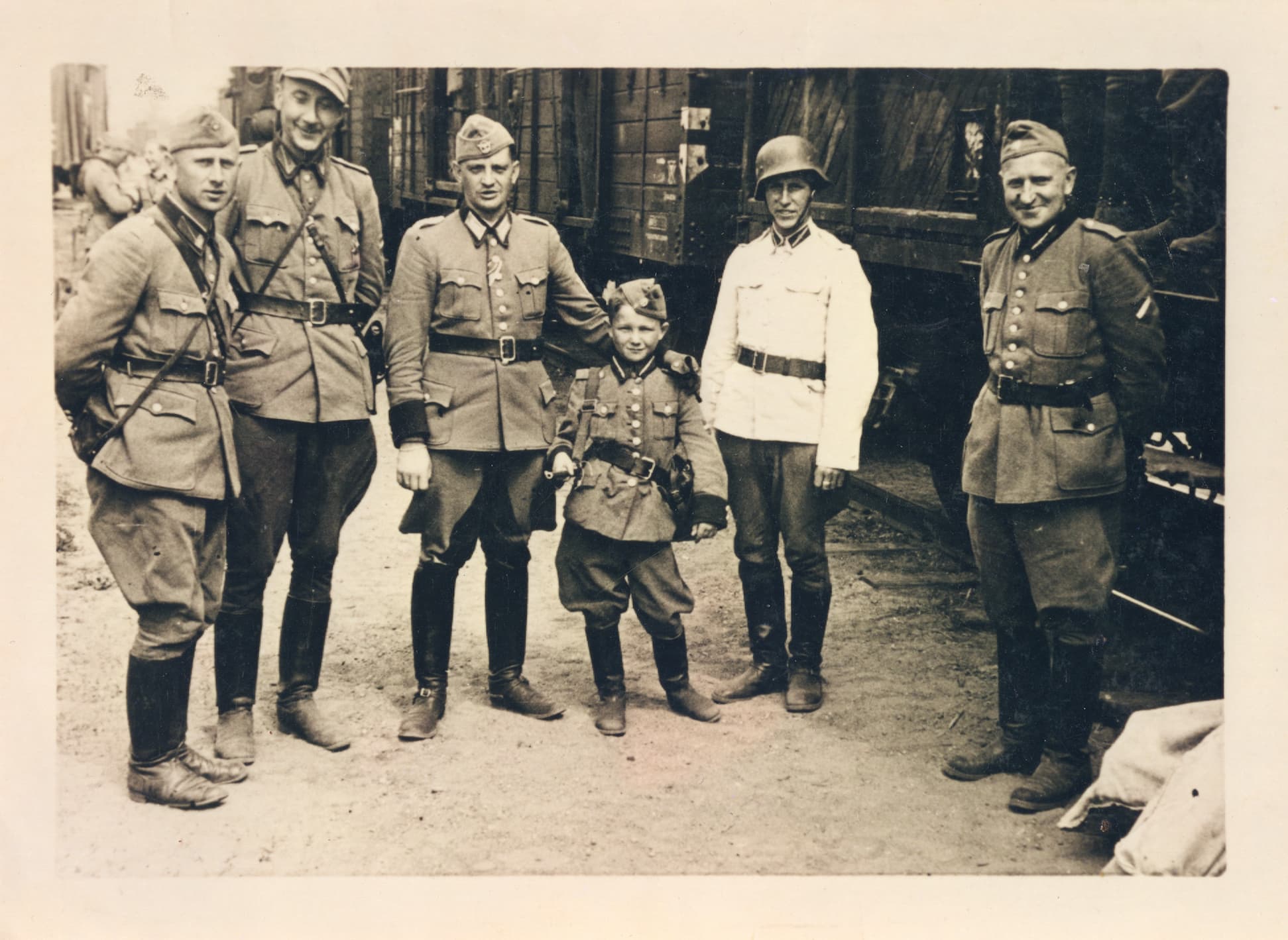 Young Alex Kurzem stands with Latvian SS batallion in a black and white image