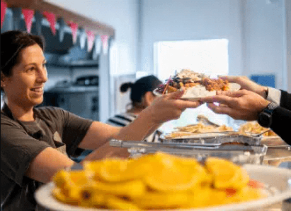 woman serving a meal