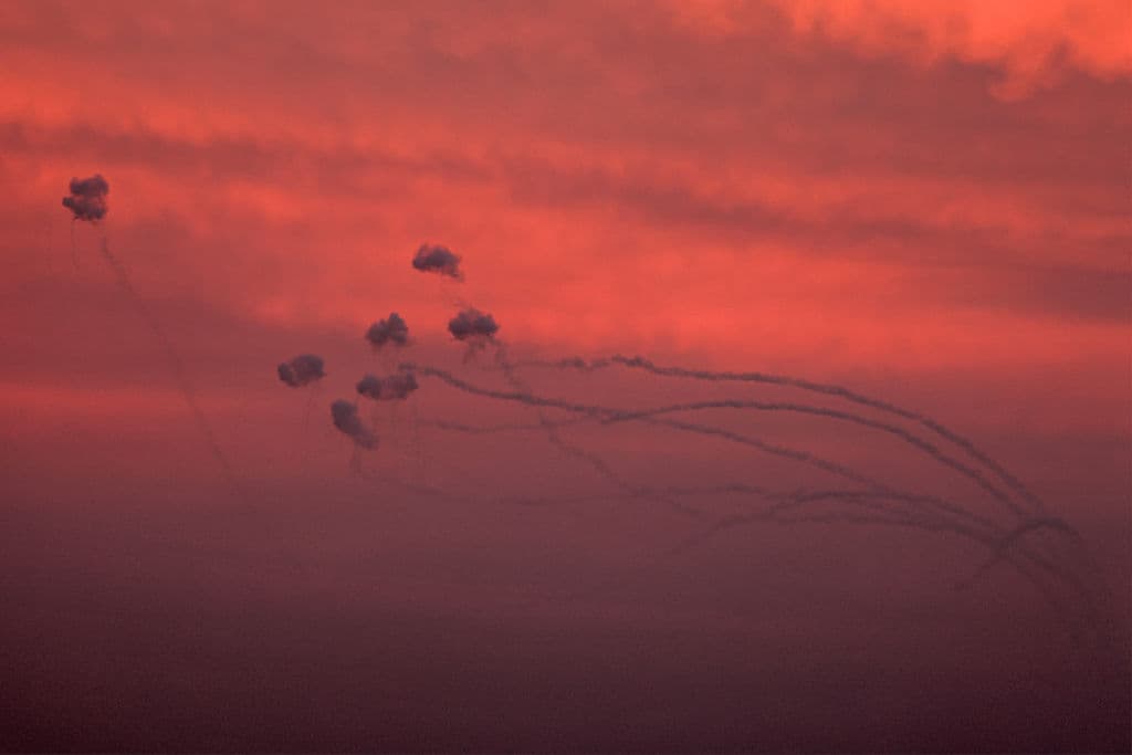 red sky, drones, smoke