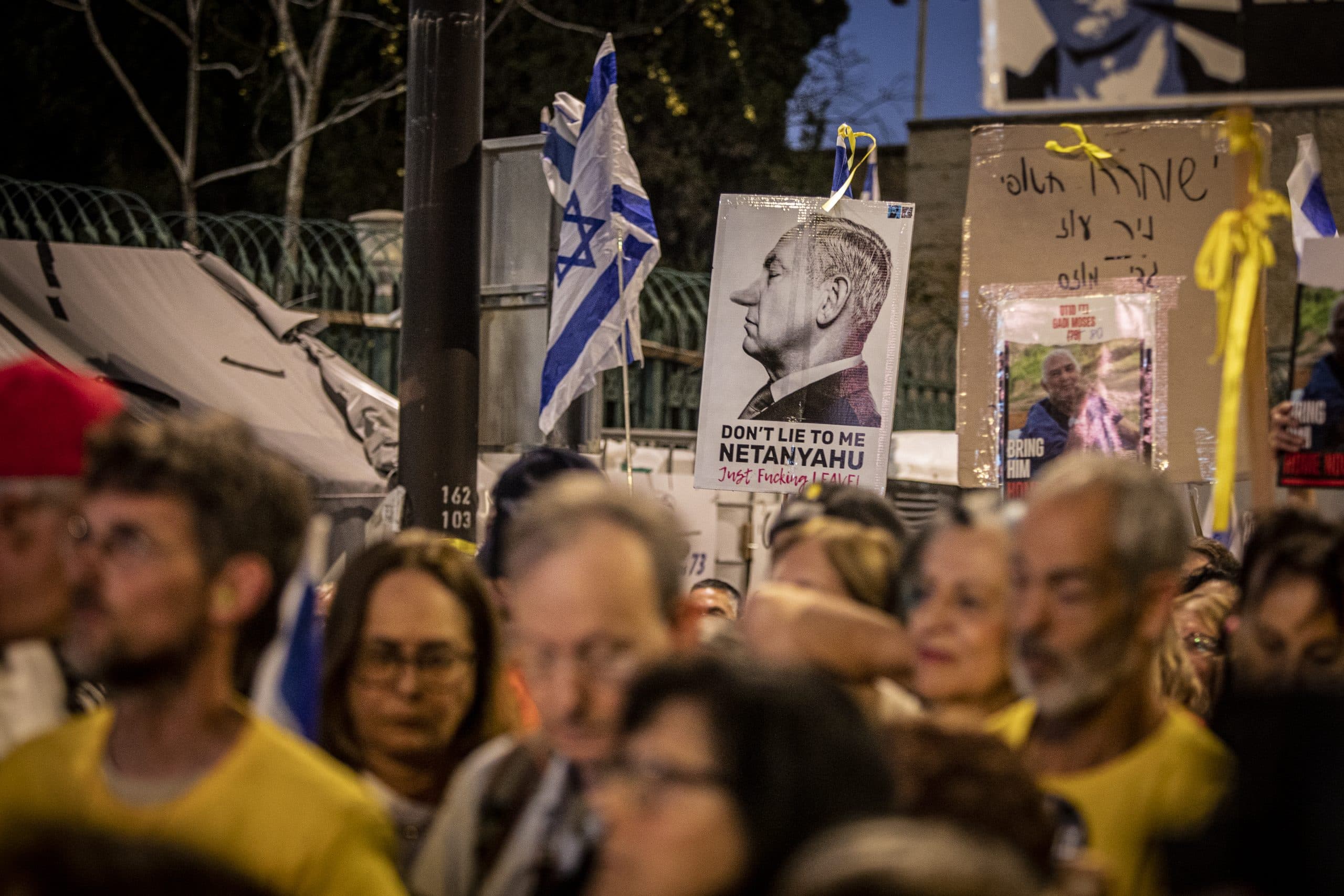 Protestors hold up a placard showing Israeli Prime Minister Benjamin Netanyahu, during a demonstration. Israeli police clashed with antigovernment protesters outside Prime Minister Benjamin Netanyahu's home in Jerusalem which was the third day of demonstrations calling for early elections and his ouster. Thousands of protesters protested in the streets of Jerusalem ever since Sunday, when a planned four-day antigovernment protest began outside Israel's Parliament, the Knesset. Many protesters have camped out in tents outside the Knesset, where the demonstrations have swelled each evening. (Photo by Eyal Warshavsky / SOPA Images/Sipa USA)
