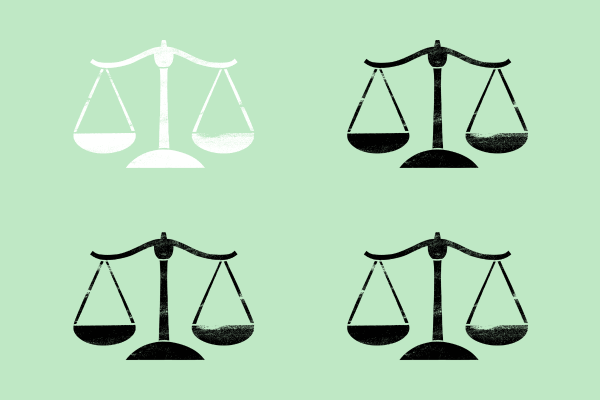 Four scales on a green background, three are black, one is white