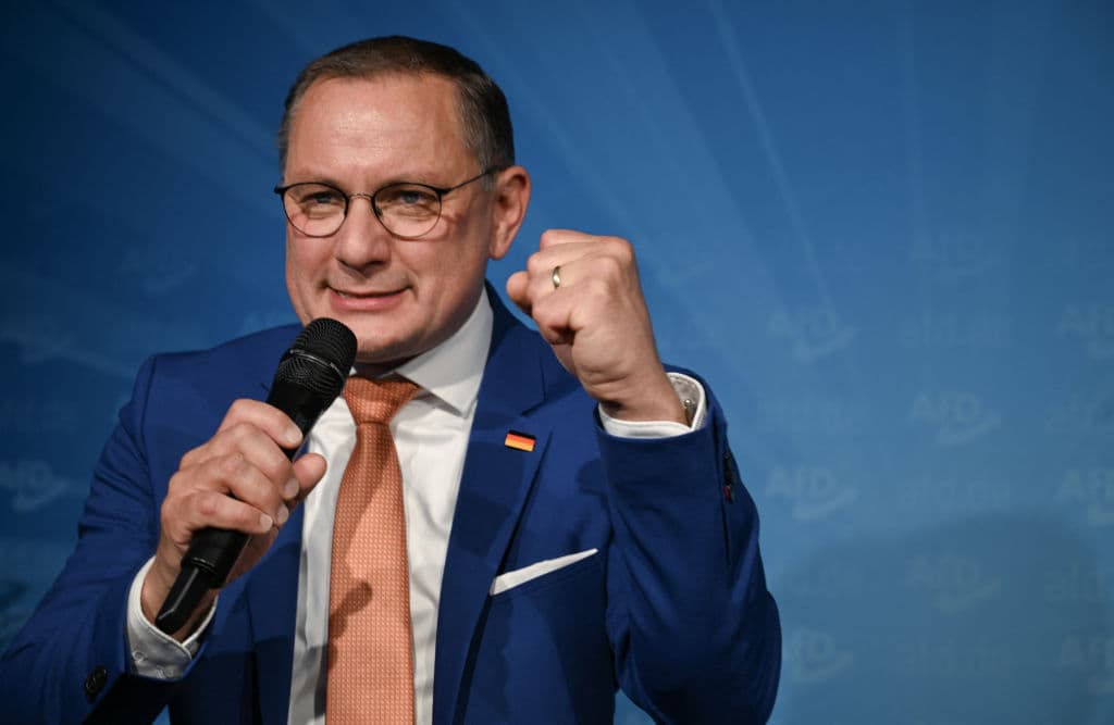 Man with microphone and clenched fist