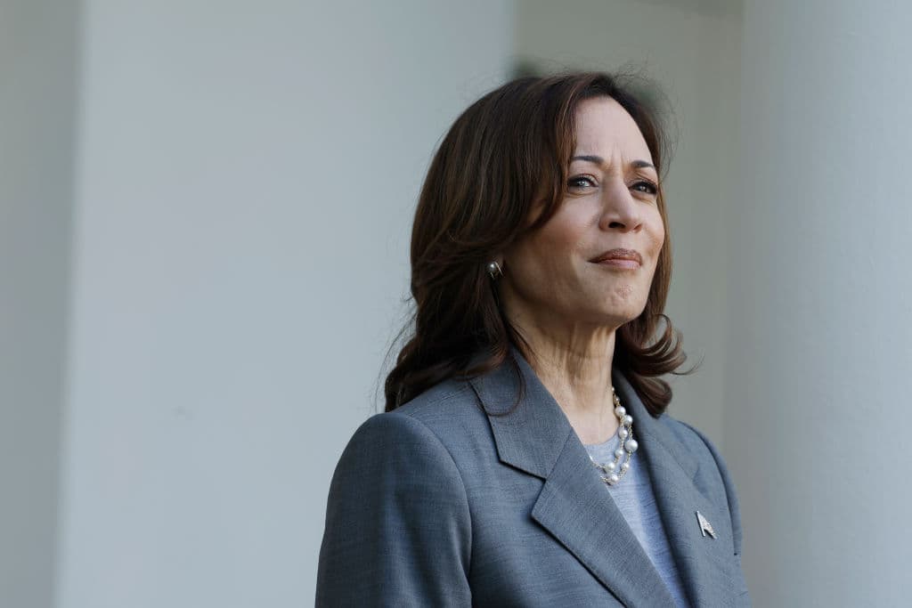 Woman in grey suit jacket