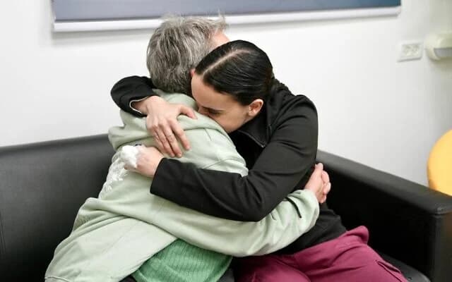 Emily Damari (right) embraces her mother, Mandy, after her return from Hamas captivity, January 19, 2025. (IDF)