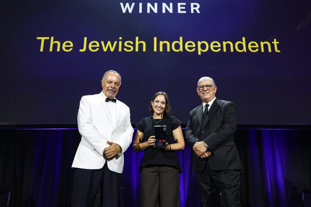 Ruby Kraner-Tucci accepting the award at The Premier's Harmony Dinner 2025 (Image: Salty Dingo).