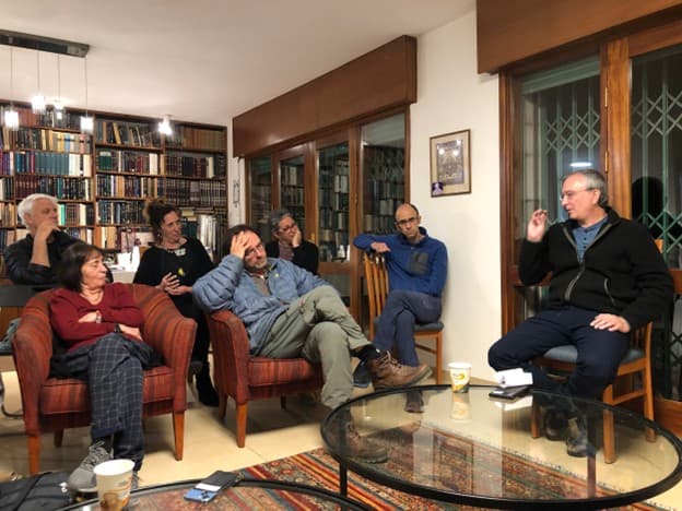 Eran Etzion speaks to supporters of The Democrats at a home in Jerusalem (Ittay Flescher)
