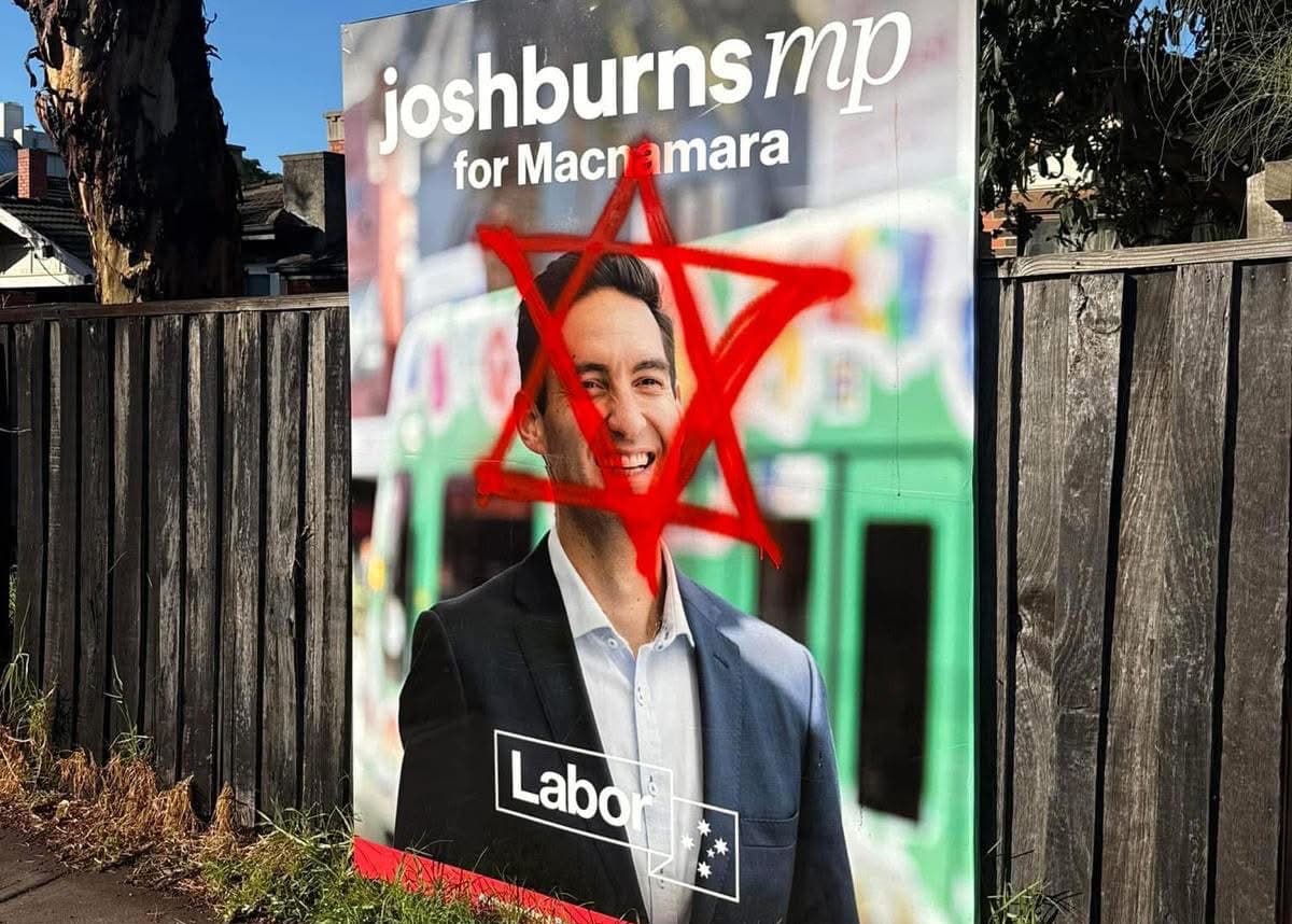 Election poster for Josh Burns with a red graffiti star of David around his face