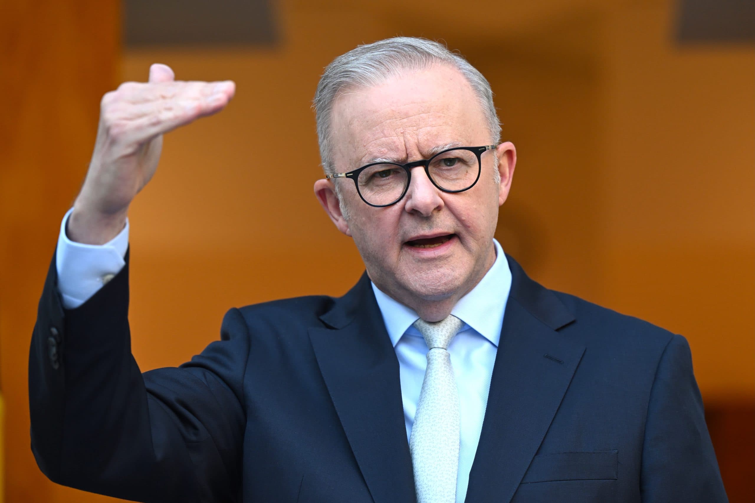 Man in suit gesturing