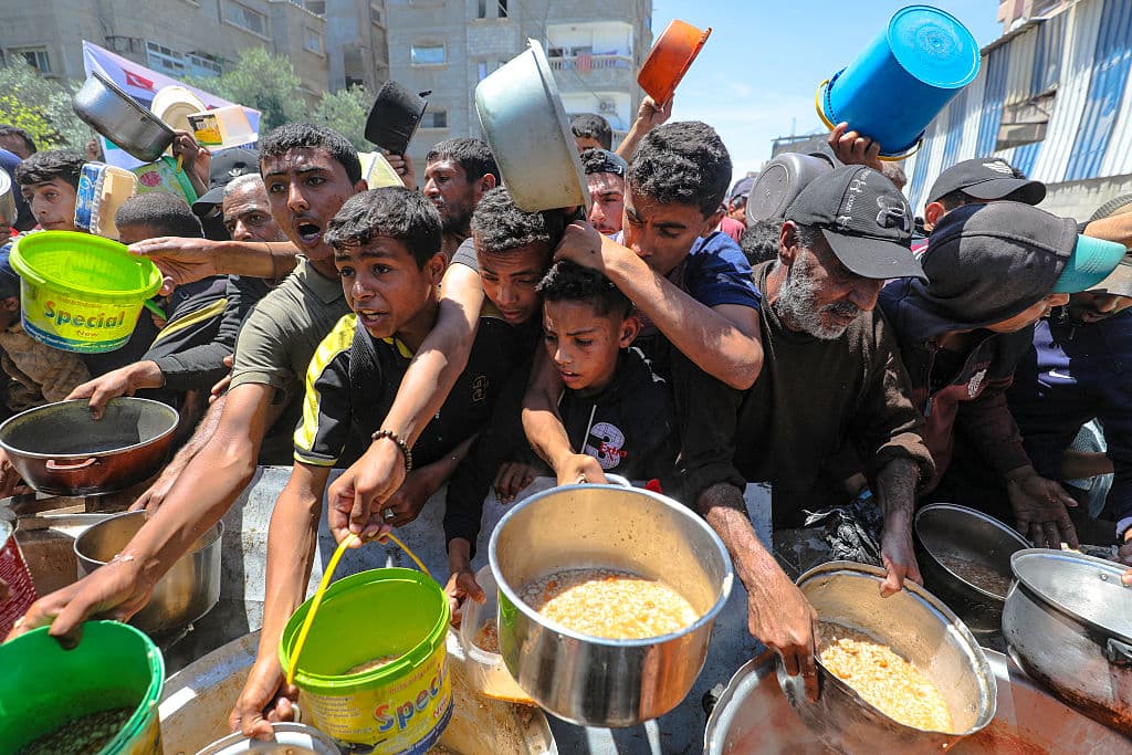 A crowd of boys and me with empty food containers