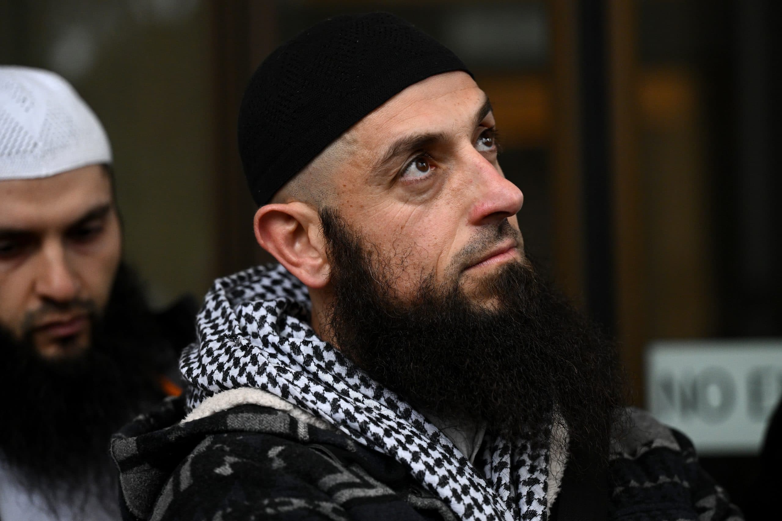 Man wearing a keffiyah and head covering