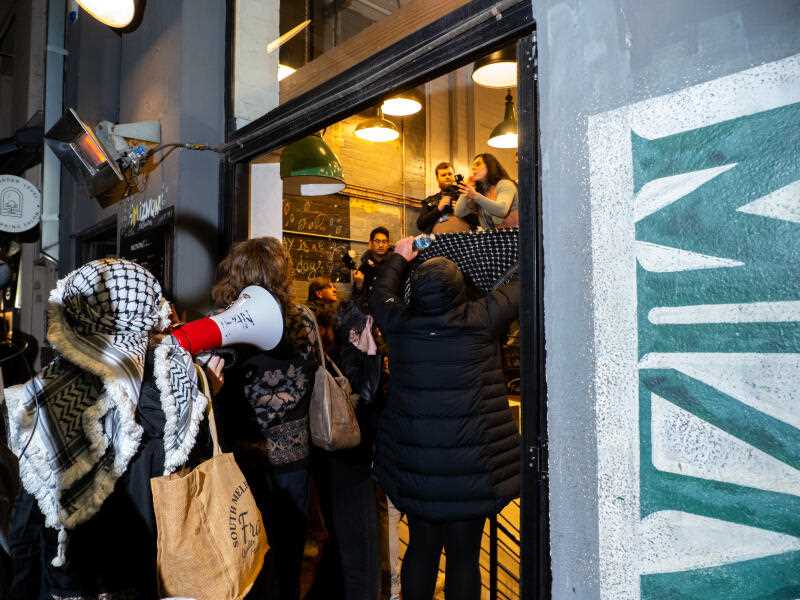 Protesters enter Miznon, an Israeli restaurant on the iconic Hardware Lane, on 4 July 2025 (Photo by Alex Zucco/ SOPA Images/Sipa USA via AAP).