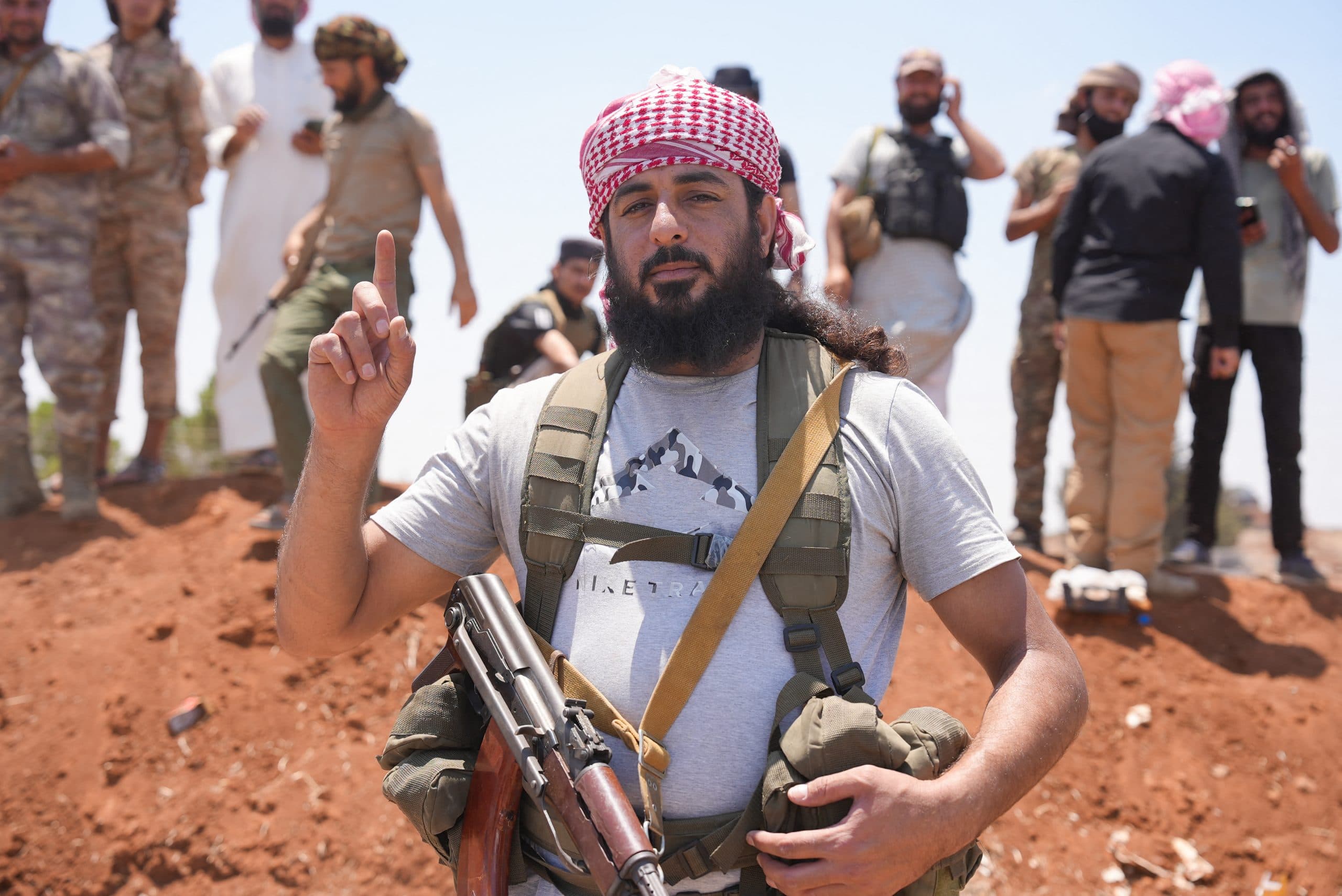 Man in a headscarf with a gun