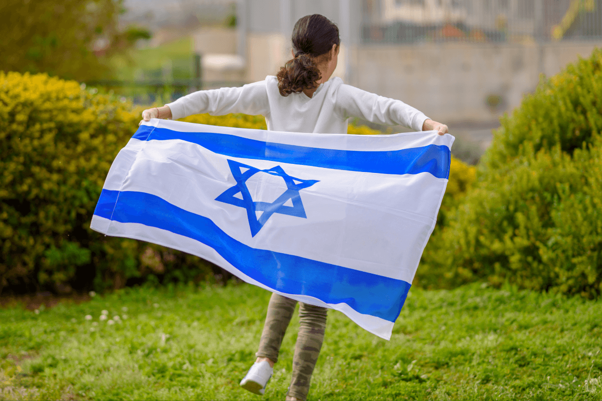 Young girl wearing Israeli flag