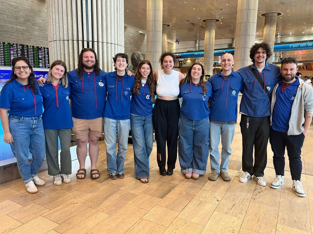 Zandra, in white top, joining fellow Habonim Dror alumni at Ben-Gurion Airport in March, 2025 (Image: supplied).