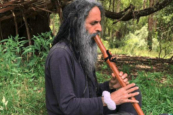 Israeli-Australian musician Ari playing flute in Sherbrooke Forest