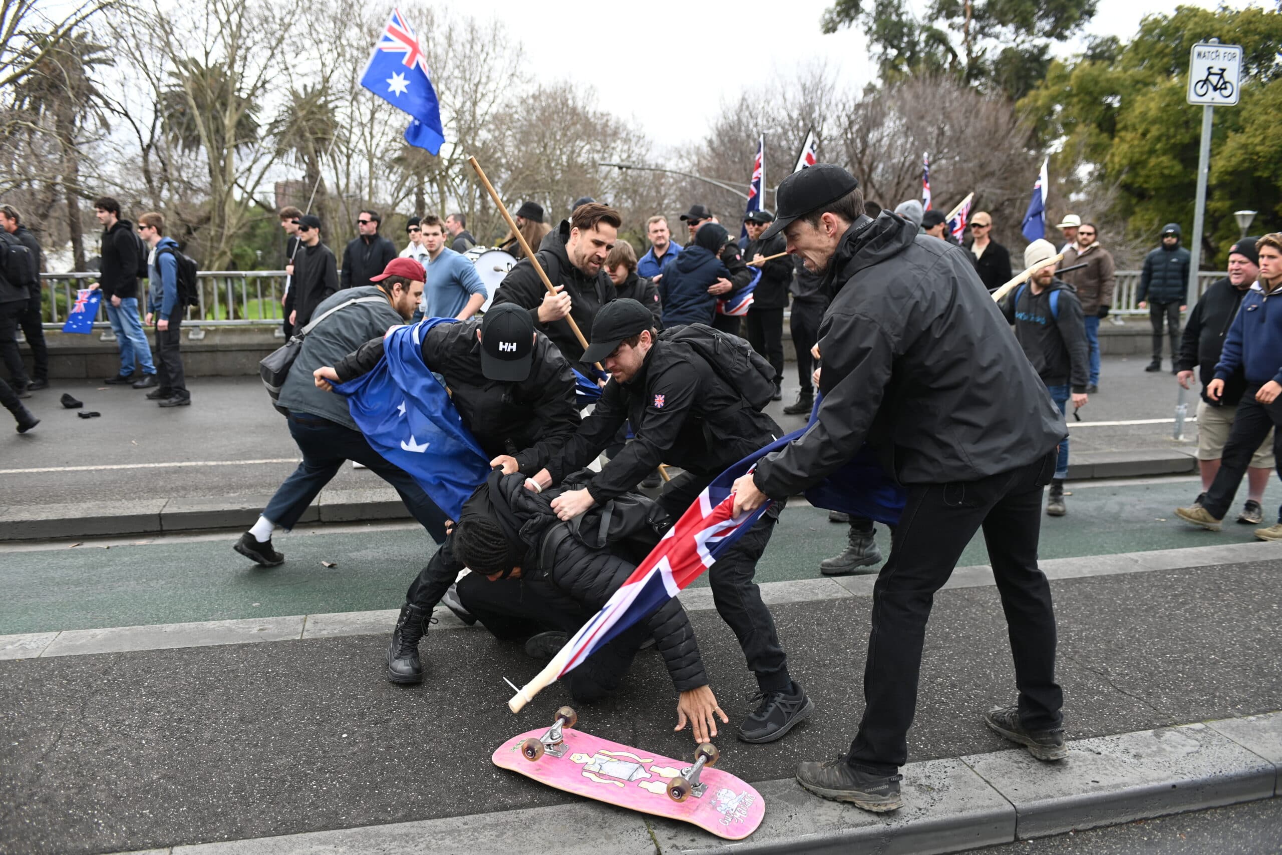 A fight at the anti-immigration protest in Melbourne on Sunday where pro-Palestinian and anti-immigration protesters clashed
