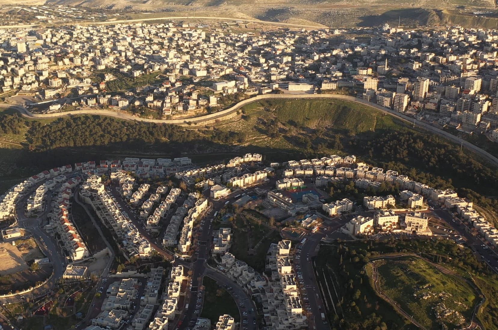 The security barrier dividing the Jewish neighborhood of Pisgat Ze’ev in East Jerusalem from the Palestinian village of Anata in the West Bank