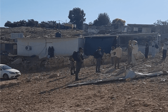 Residents of Umm Al-Khair and protective presence volunteers recording IDF soldiers (Image: supplied).
