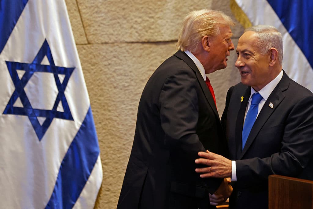 U.S. President Donald Trump speaks with Israel's Prime Minister Benjamin Netanyahu in the Knesset