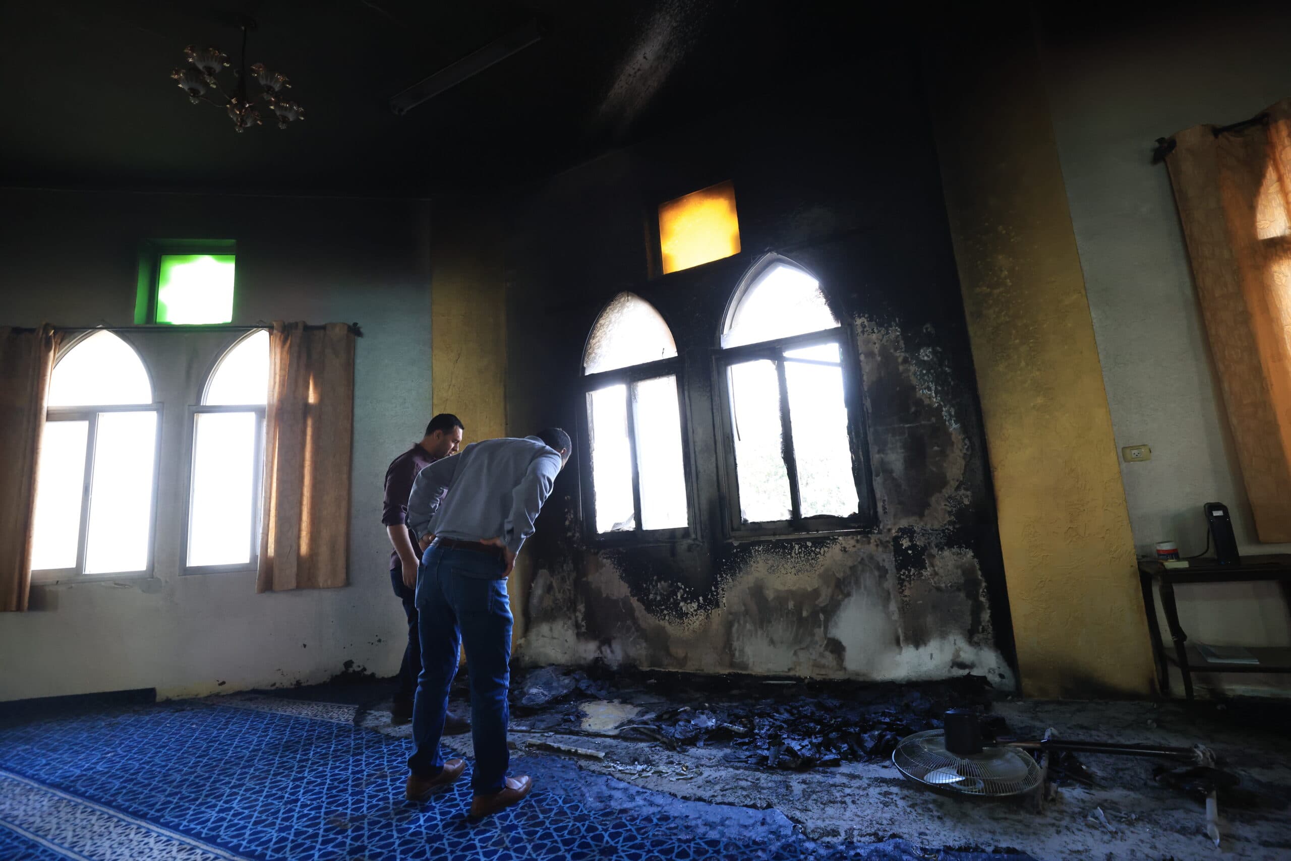 Two men inside burned mosque