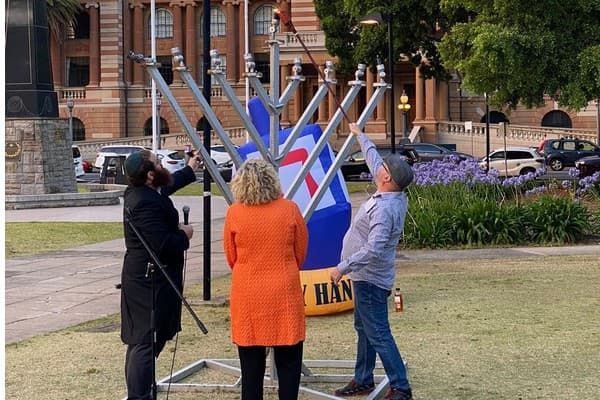 Rabbi Rodal lighting the Newcastle menorah