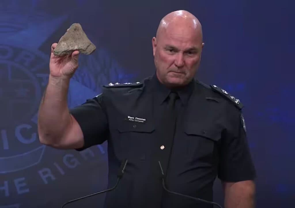 Victoria Police Commander Wayne Cheeseman with a rock thrown at police during a protest in October (Victoria Police)