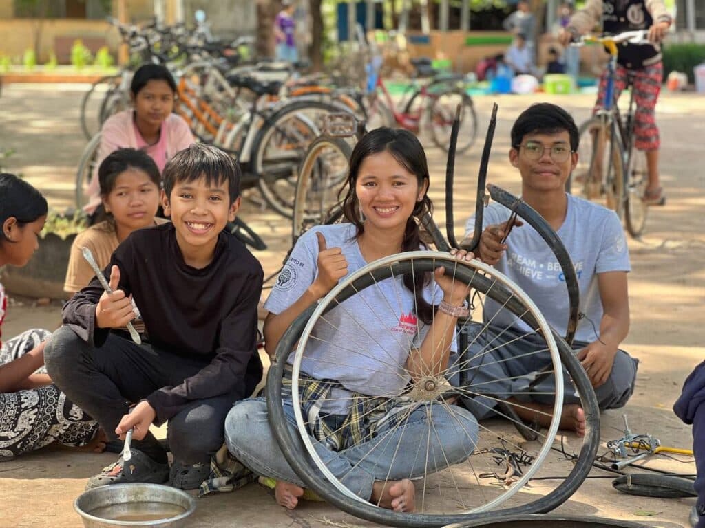 CRST students volunteering with Project B – Bicycles for Education, reparing bicycles for rural students (Image: supplied).