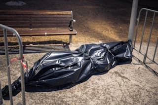 Wrapped flowers from the Bondi temporary memorial ressemble a body bag (Anastasia Glushko)