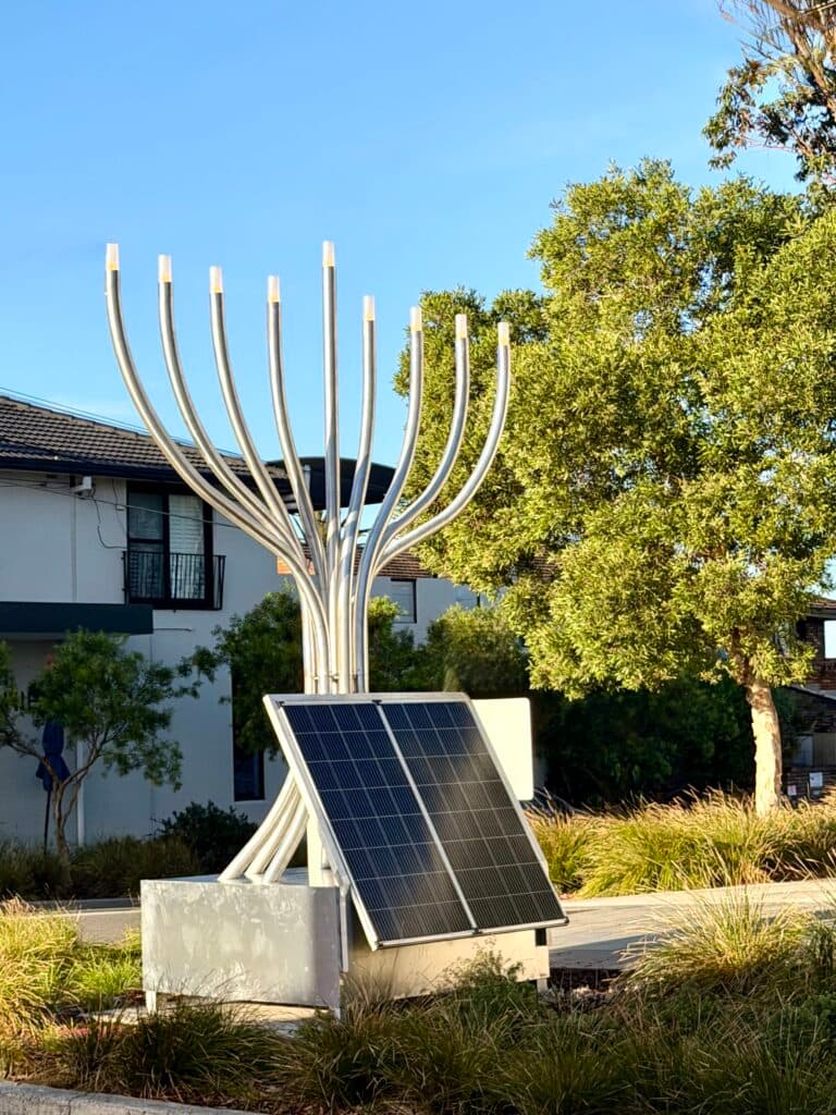 A large solar panel captures to be converted into Chanukah lights (Joel Adler)