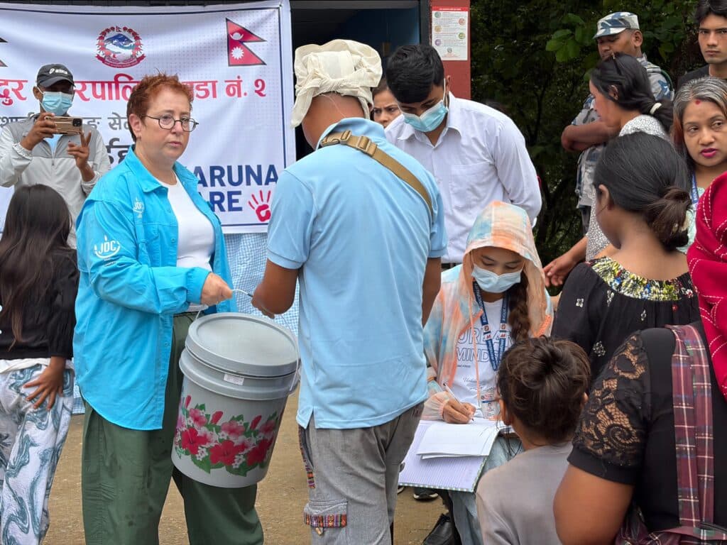 Avital Sandler-Loeff (left) aids Nepal's flood victims (JDC)