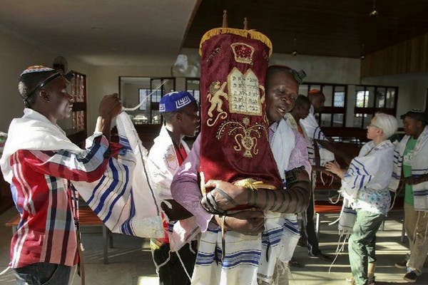 Prayers at the new Stern Synagogue in Mbale, in eastern Uganda (Stephen Wandera/AP)