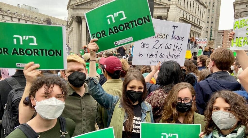 Members of Jews For Racial and Economic Justice and IfNotNow hold signs that say “Baruch Hashem For Abortion” in New York last week (Jacob Henry/JTA)