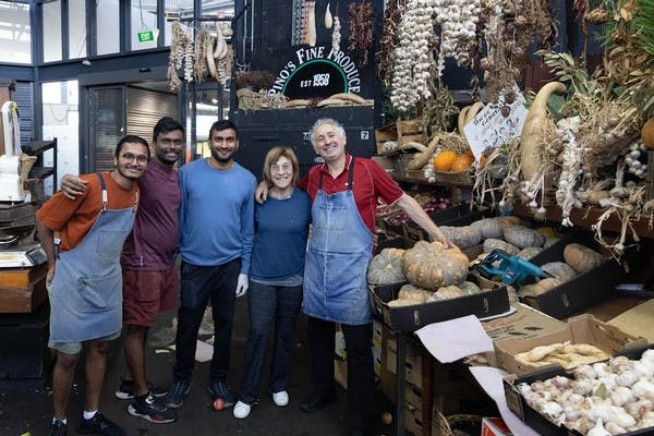 Elly Brooks with staff at Pino's Fine Produce, which donates food to Project Dignity (Deborah Stone) 