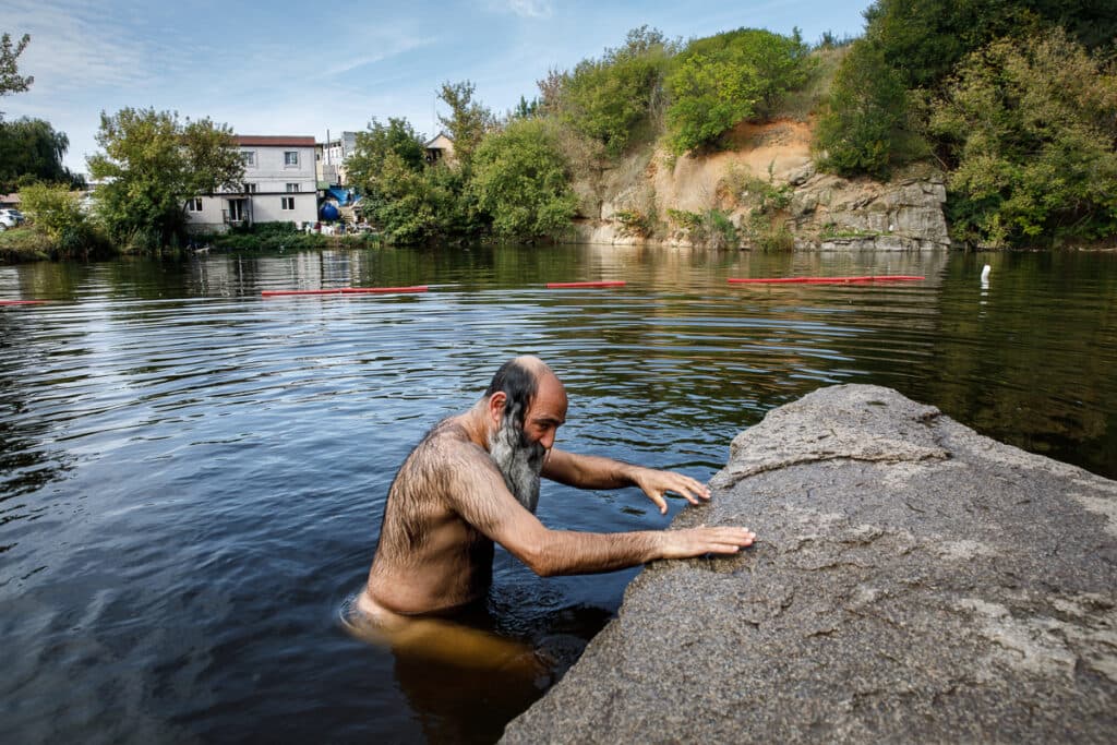 A pilgrim purifies himself with a ritual bath before praying at Rabbi Nachman's grave