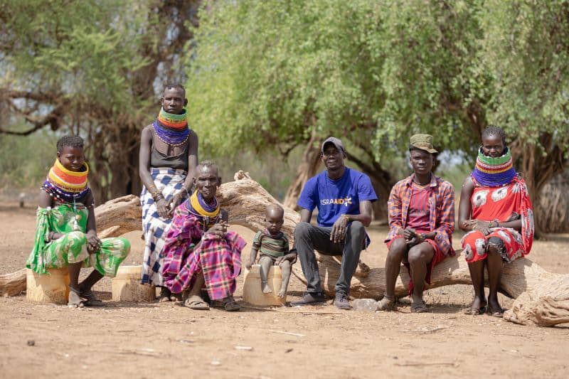 Richard Awalan (in IsraAid t-shirt) with members of his family (Lameck Ododo, IsraAid)