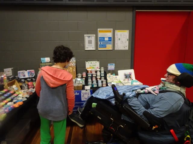 Ian and Caleb browse an indoor market