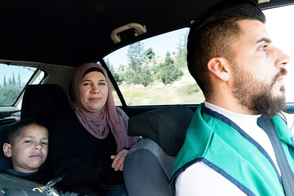 A Wheels of Hope driver takes a Palestinian mother and child to hospital in Israel (Project Rozana)