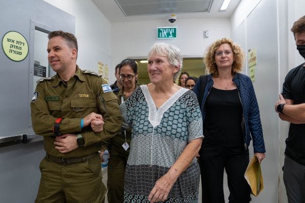 Margalit Mozes is led back into Israel (IDF)