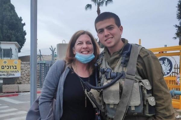 Woman with a man in army uniform