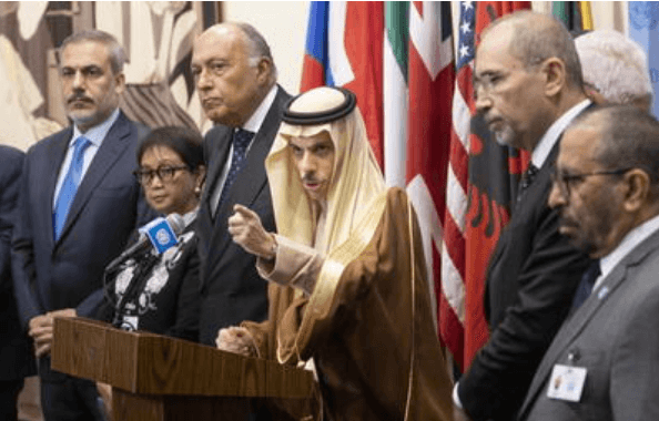 Five men and one woman around a lectern.