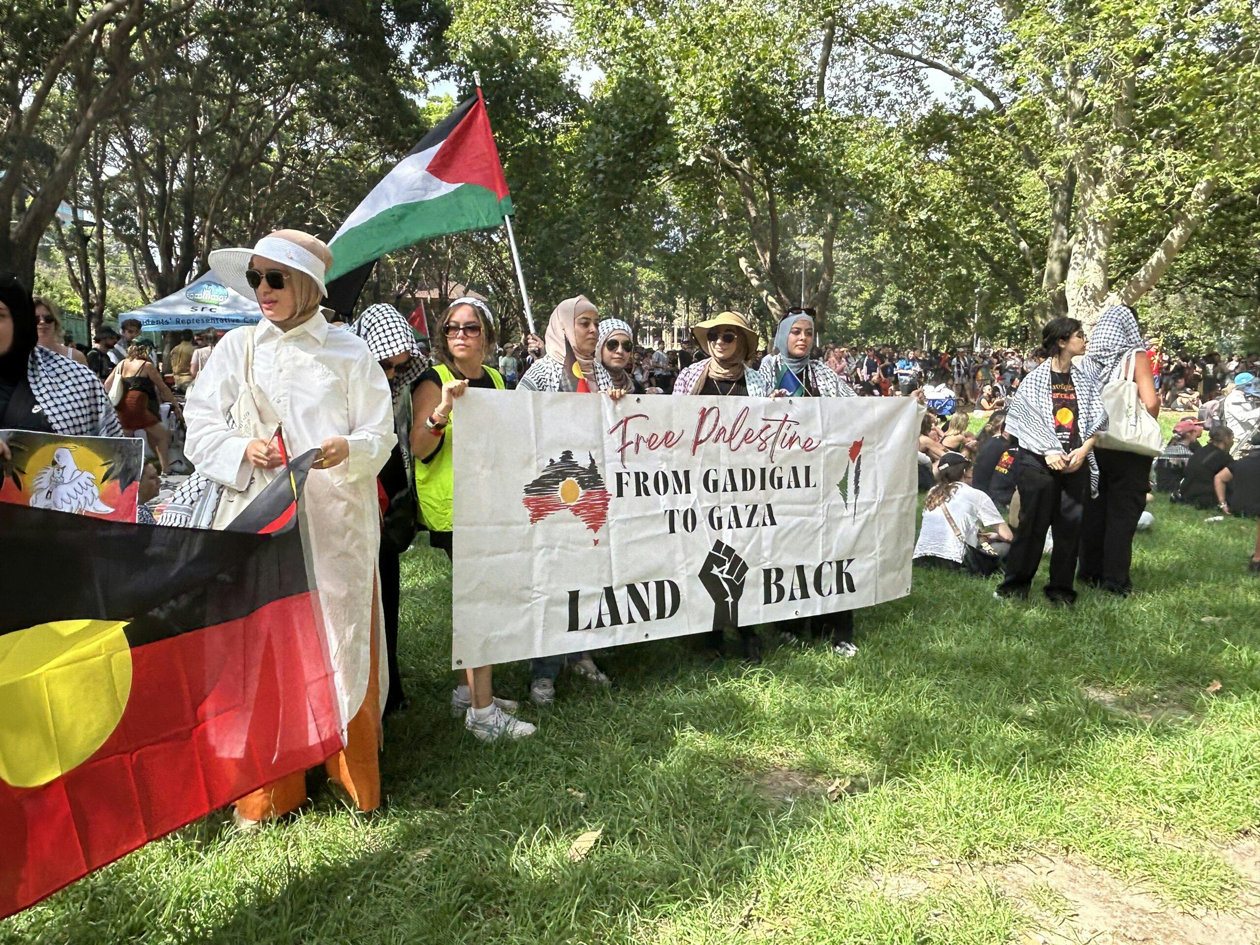 Palestinian and Aboriginal flags used together at a rally